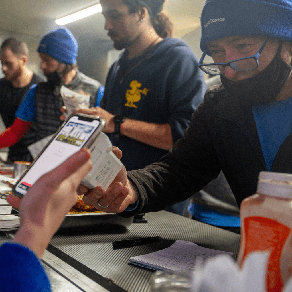 MacTassos team member serving a customer at our Greek street food van in Glasgow